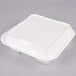 A white square Genpak foam container with 3 compartments and a hinged lid.