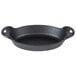 A black Lodge cast iron oval casserole dish with two handles.