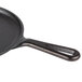 A Lodge pre-seasoned cast iron griddle with a handle.