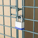A padlock on a Regency green wire security cage door.
