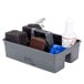 A Griddle Gear cleaning kit in a grey plastic container with cleaning supplies inside.