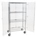 A Regency chrome wire security cage on wheels with two shelves.