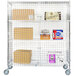 A Regency chrome wire security cage kit on wheels with boxes on shelves.