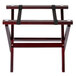 A Tablecraft mini table tray stand with a mahogany finish and black straps.