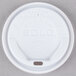 A Solo white foam cup lid with text on it.