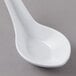 A white GET Melamine Chinese soup spoon.