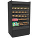 A black rectangular Structural Concepts Oasis air curtain merchandiser filled with drinks and snacks.