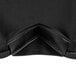A black spandex table cover with black stitching.