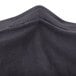 A close up of the charcoal spandex fabric of a Snap Drape Contour Table Cover.
