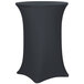 A charcoal Snap Drape spandex table cover on a black table in an outdoor catering setup.
