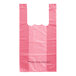 A pink plastic bag with handles.