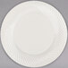 A white Visions plastic plate with a swirl pattern.
