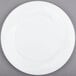 A Visions white plastic plate with a circular pattern.