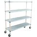 A white MetroMax Q three tiered metal shelving unit with black rubber wheels.