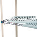 A MetroMax Q open grid shelf cart with rubber casters and metal shelves.