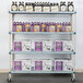 A MetroMax Q shelf with bottles and boxes on it.