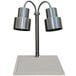 A Hanson Heat Lamps stainless steel carving station with two heat lamps over a white surface.