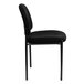 A Flash Furniture black fabric stackable side chair with a black cushion.
