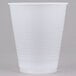 A close-up of a Dart translucent plastic cup on a white surface.