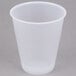 A Dart Conex plastic cup on a gray background.