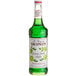 A green bottle of Monin Granny Smith Apple Syrup with a white label.