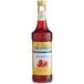 A bottle of Monin Sugar Free Strawberry Syrup on a white background.