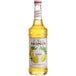 A Monin 750 mL bottle of lemon syrup.