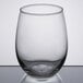 A Libbey stemless wine glass with a clear rim on a table.