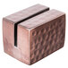An American Metalcraft rectangular hammered copper table card holder with a textured surface.