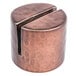 An American Metalcraft round hammered copper card holder with a metal knob.
