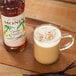 Monin 750 mL Organic Vanilla Flavoring Syrup Main Thumbnail 1
