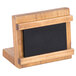 A wooden Cal-Mil Madera chalkboard stand with a black rectangular chalkboard on it.