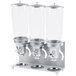 A silver metal Cal-Mil cereal dispenser with three clear glass canisters on a metal stand.
