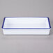 A white rectangular melamine tray with a blue border.