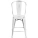 A Flash Furniture white metal counter height stool with a vertical slat backrest.