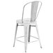 A Flash Furniture white metal counter height stool with a vertical slat back.