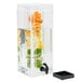 A Cal-Mil clear plastic beverage dispenser with orange slices in the infusion chamber.