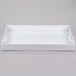 A white rectangular plastic tray with handles.