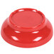 A red melamine salsa dish with a white background.