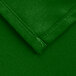 A close up of a green Intedge square cloth table cover with a hemmed edge.