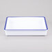 A white rectangular melamine tray with blue trim.