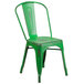 A green metal Flash Furniture restaurant chair with a slatted seat.
