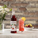 Monin 750 mL Premium Strawberry Flavoring / Fruit Syrup Main Thumbnail 3