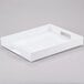 A white rectangular Cal-Mil plastic tray with handles.