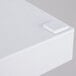 A white rectangular plastic tray with handles on a white surface.