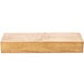A wooden rectangular plate riser with a rustic finish.