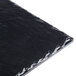 A black square melamine serving platter with a shiny surface.