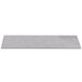 A rectangular grey faux cement serving platter on a white surface.