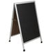An aluminum A-Frame black chalkboard with a white background.