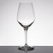 A clear Spiegelau Authentis wine tasting glass on a table.